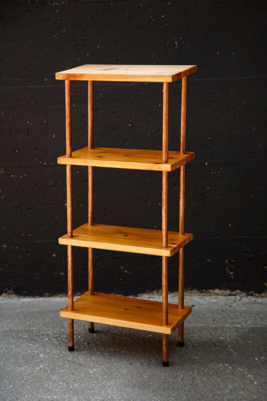 shelf made from copper pipes and pine construction scraps