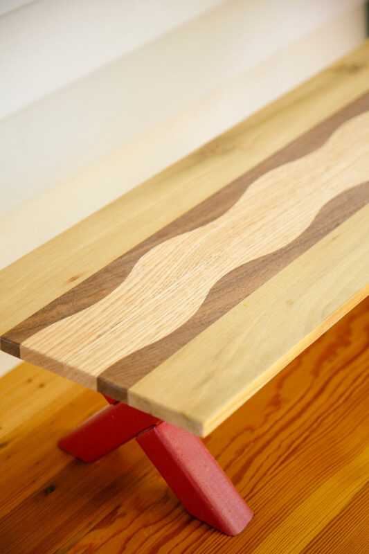 riser made from scraps and salvaged bits of walnut, oak and tulip poplar Upcycled kitchen organization shelf made by Upstate artisan featuring contrasting walnut, oak and tulip poplar in a wavy design. Sustainable home decoration for kitchen organization.