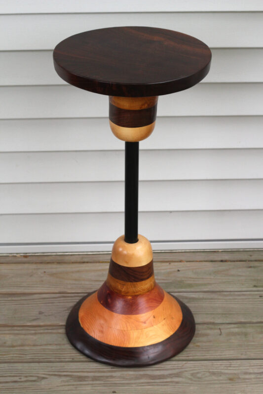 side table made from an upcycled pipe and a pile of scraps