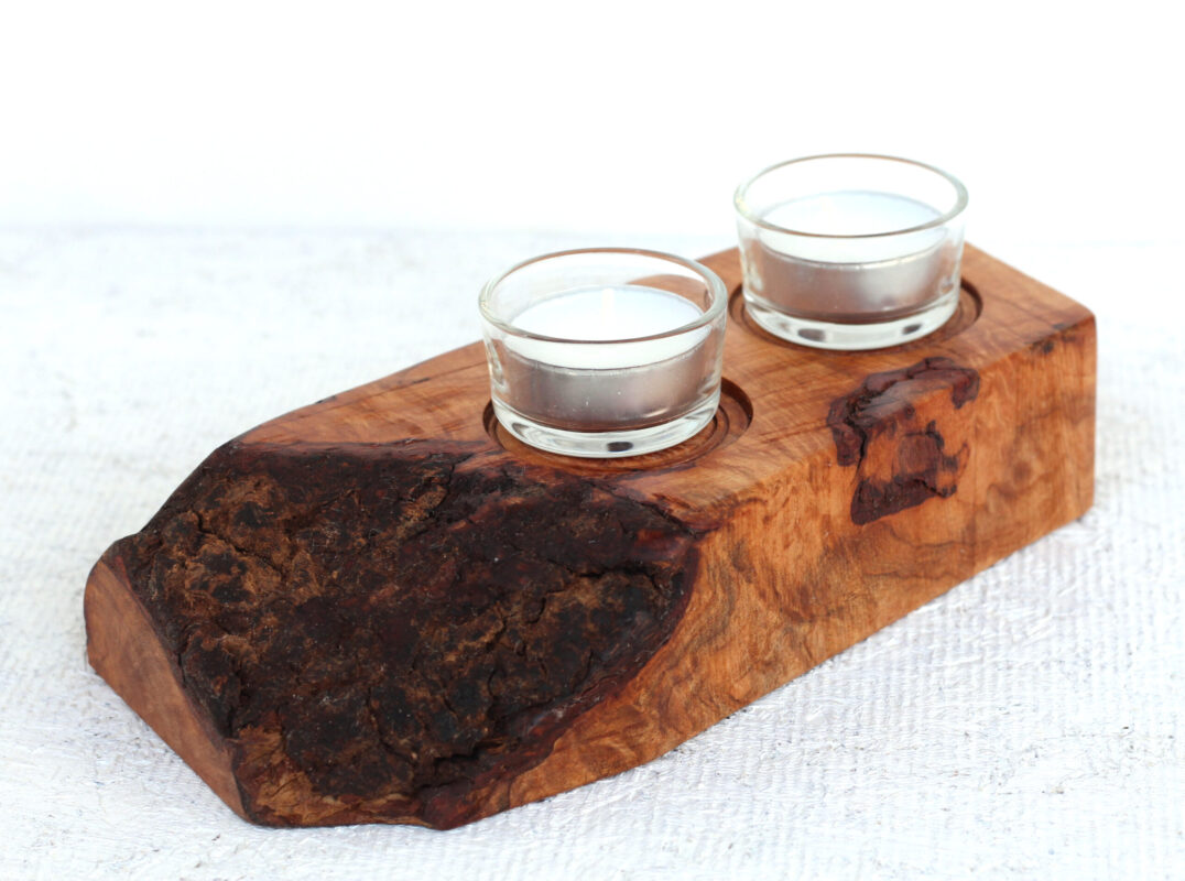 candle holders made from live edge curly maple scraps Candle holders made from live edge curly maple scraps. The bark shows on the left side and two tea candles are perched on top of a one-of-a-kind artisinal piece that was hand crafted in the Hudson Valley in the vicinity of Gardiner, Accord and Wurtsboro.